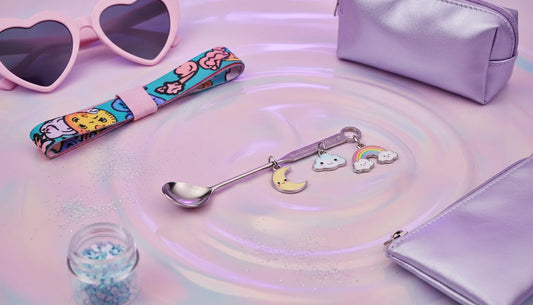 Pastel ravecore flatlay featuring a bump straw for powder styled with charms and festival accessories