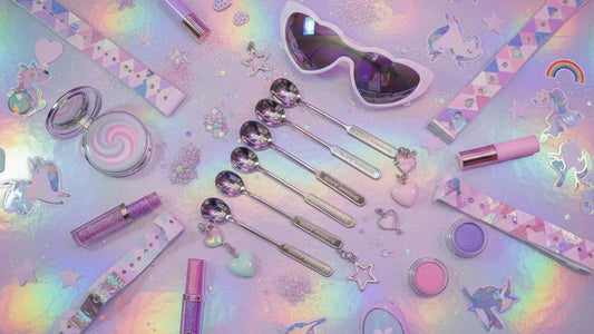 Colorful bump straws and festival accessories arranged on a holographic pastel surface with glitter accents