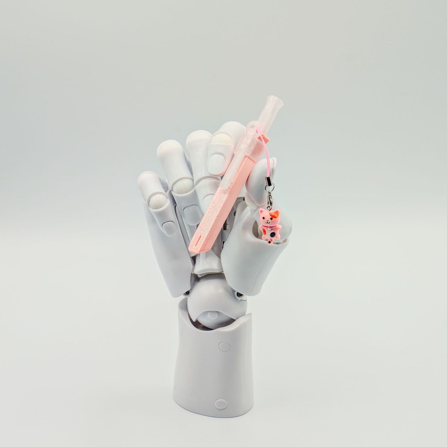Pink bump straw powder spoon with tiger charm, perfect for measuring cacao or powders