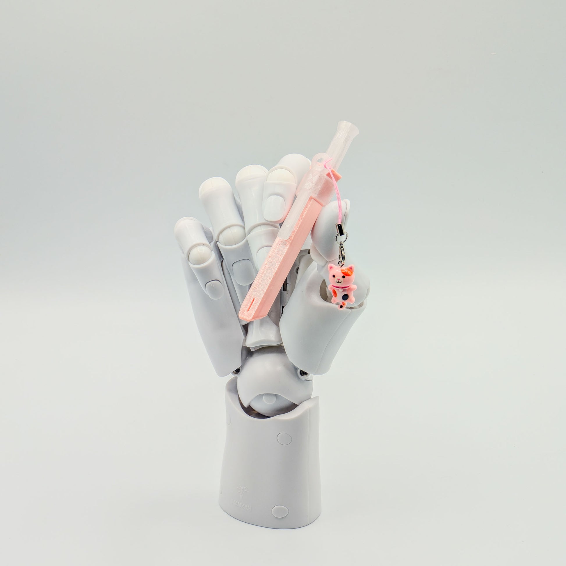 Pink bump straw powder spoon with tiger charm, perfect for measuring cacao or powders