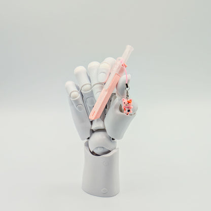 Pink bump straw powder spoon with tiger charm, perfect for measuring cacao or powders