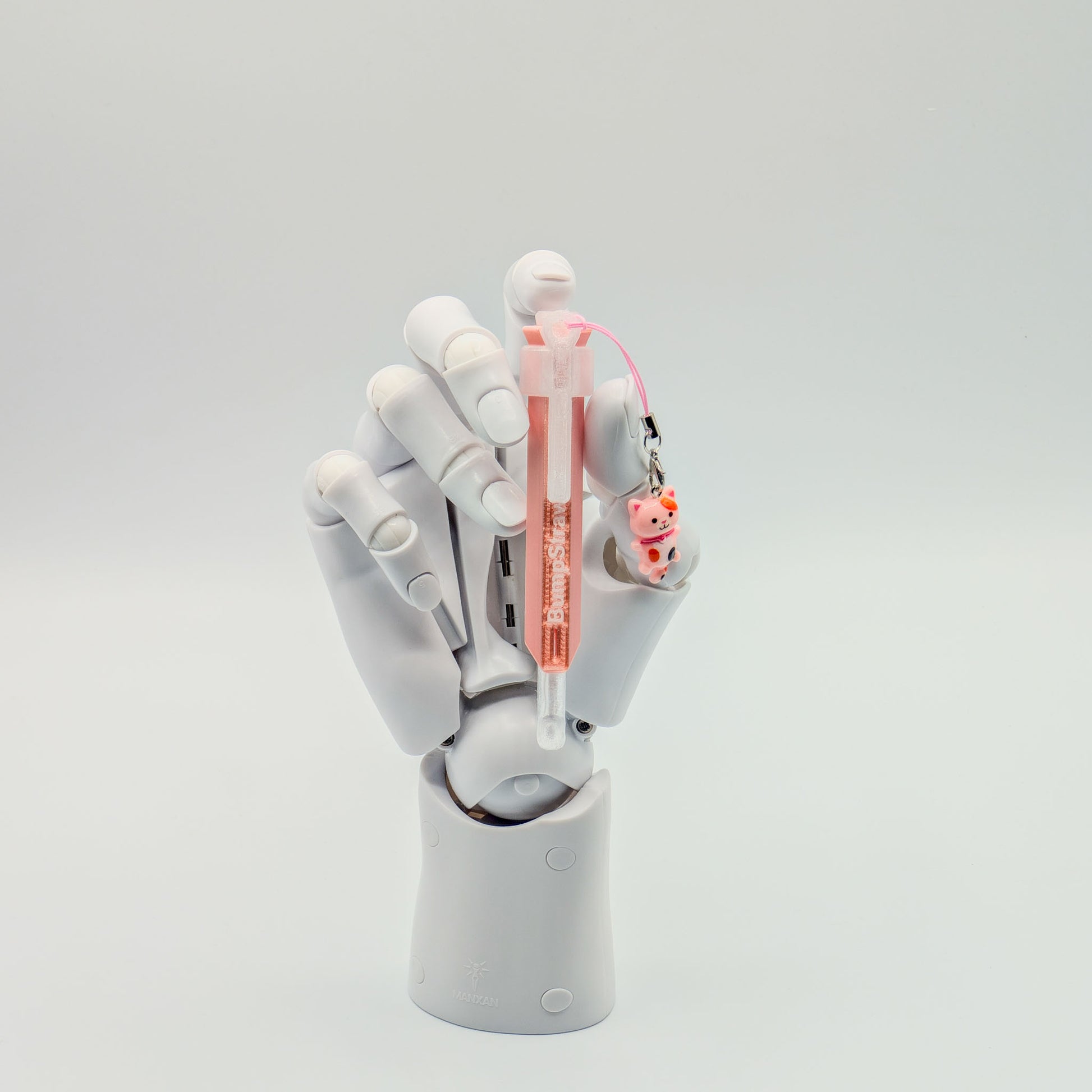 Pink bump straw powder spoon with tiger charm, perfect for measuring cacao or powders