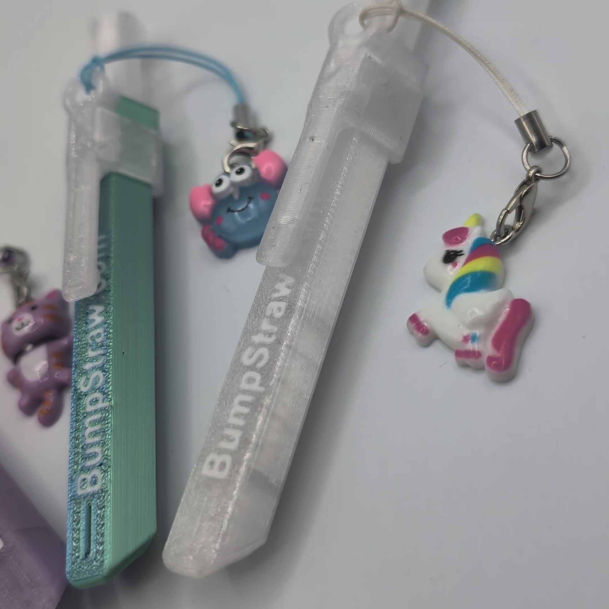 Video of BumpStraw bundle set of powder spoons with charms in purple, orange, blue, clear for cacao and powders