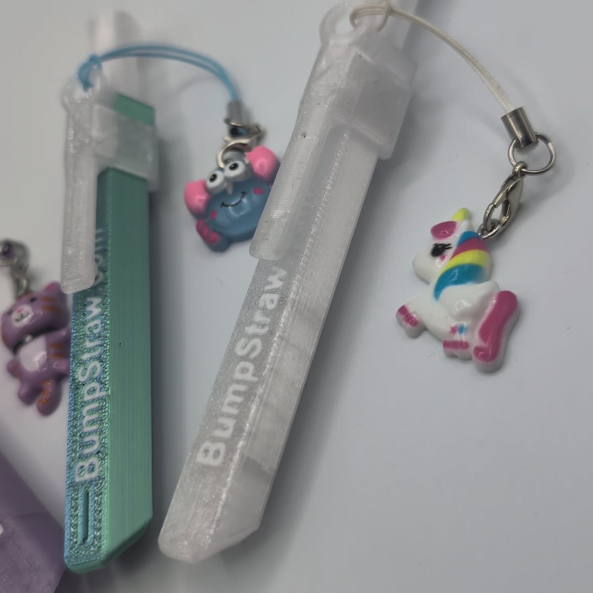 Video of BumpStraw bundle set of powder spoons with charms in purple, orange, blue, clear for cacao and powders