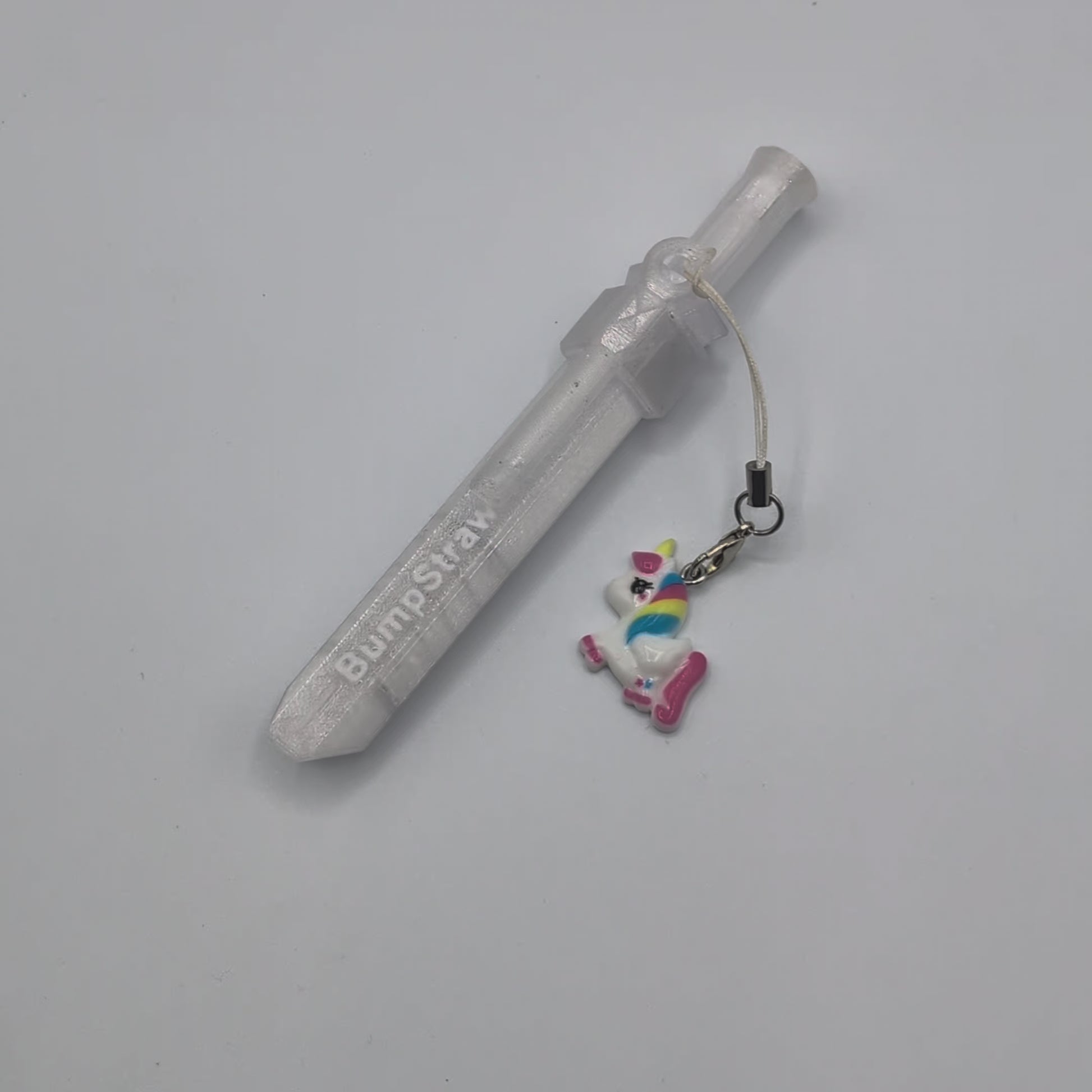 Video of clear BumpStraw bump straw powder spoon with unicorn charm for cacao