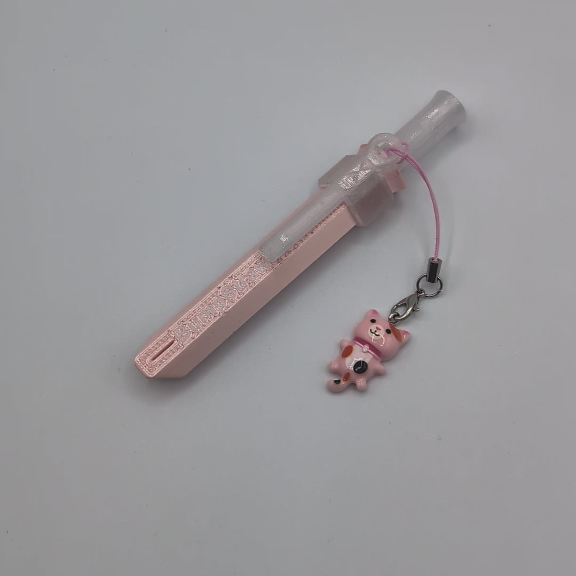 Video of pink BumpStraw powder spoon bump straw with cat charm for cacao and powders