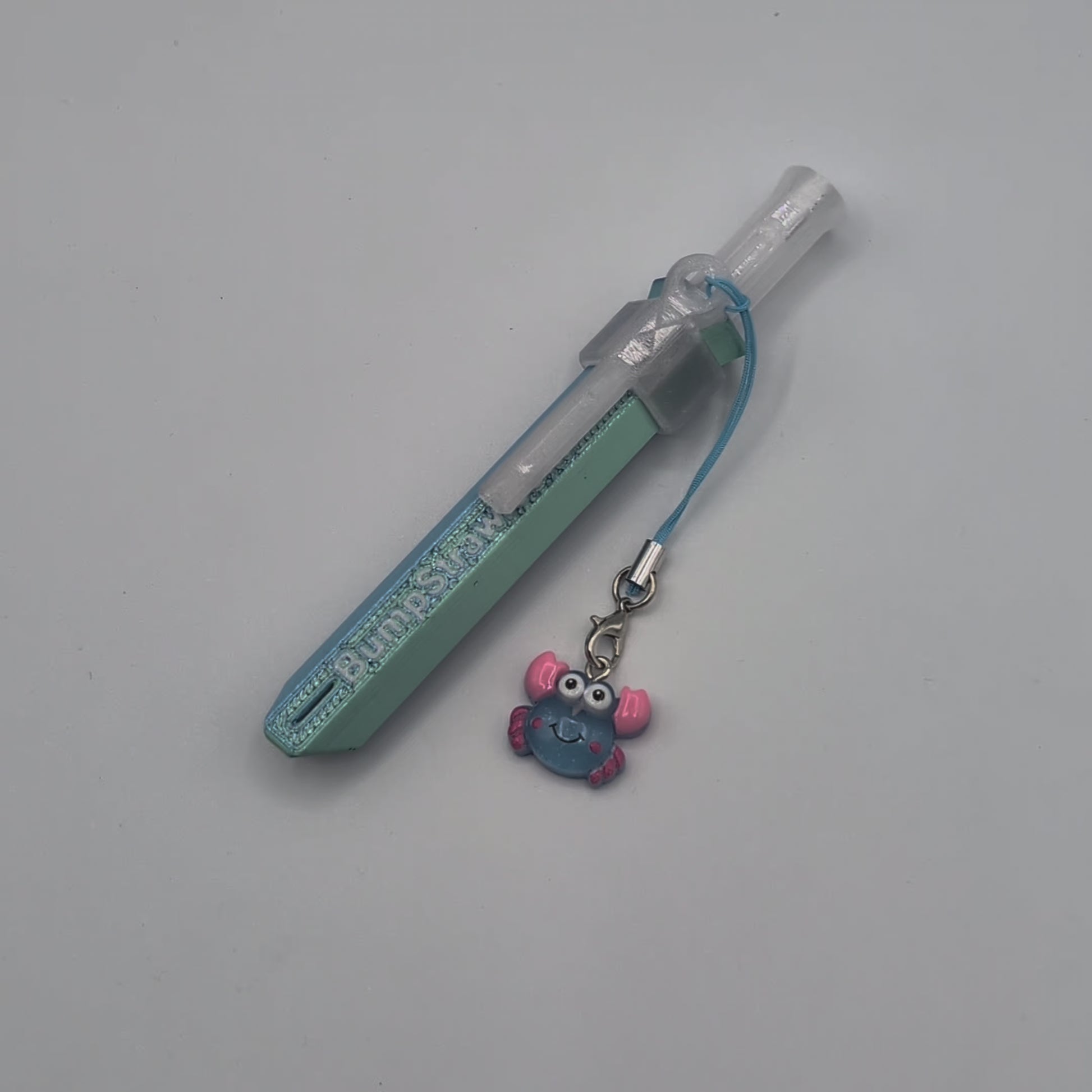 Video of blue BumpStraw powder spoon bump straw with crab charm, ideal for cacao