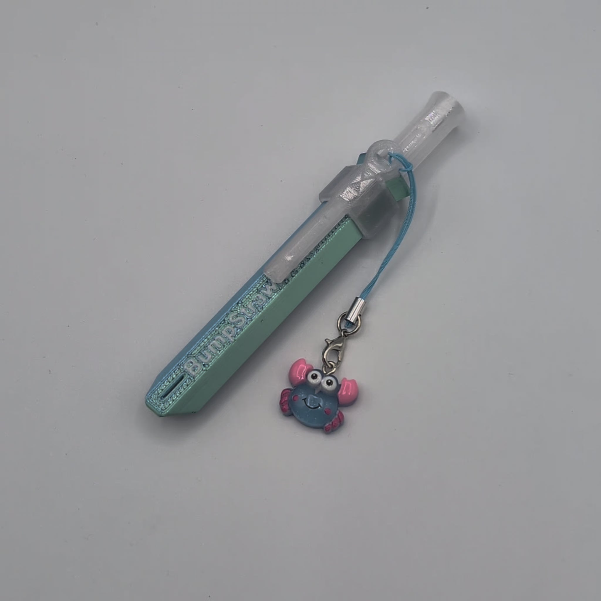 Video of blue BumpStraw powder spoon bump straw with crab charm, ideal for cacao